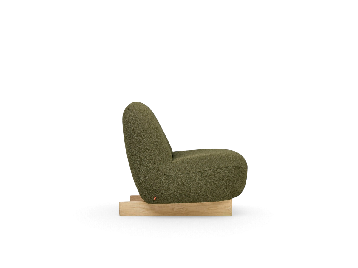 urbane EQ3 Arlo chair in olive green bouclé fabric with a solid oak sled base, side view
