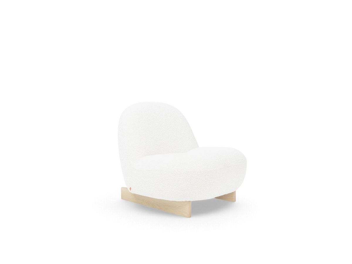 urbane EQ3 Arlo chair in white nubby bouclé fabric with a solid oak sled base and curved, compact design.