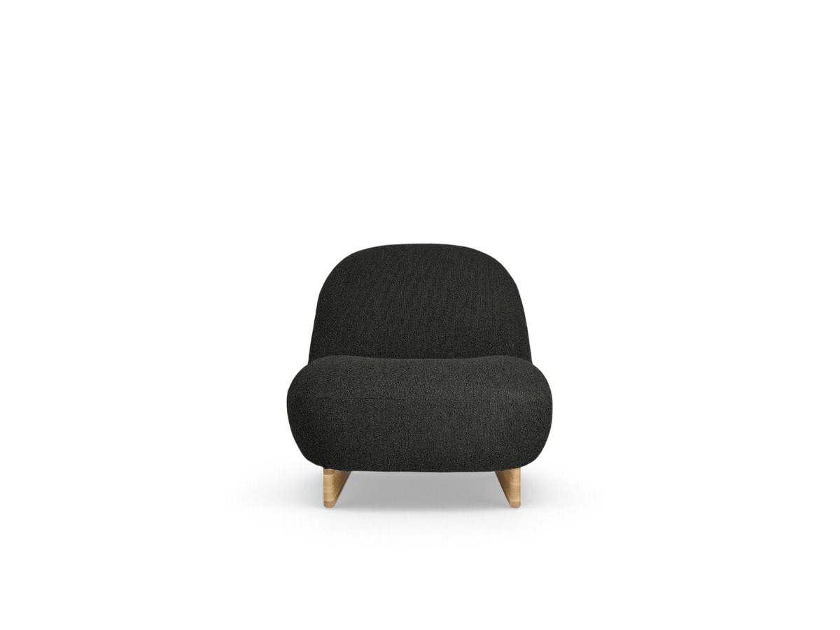 urbane EQ3 Arlo chair in dark grey bouclé fabric with a solid oak sled base, featuring a compact, curved design.