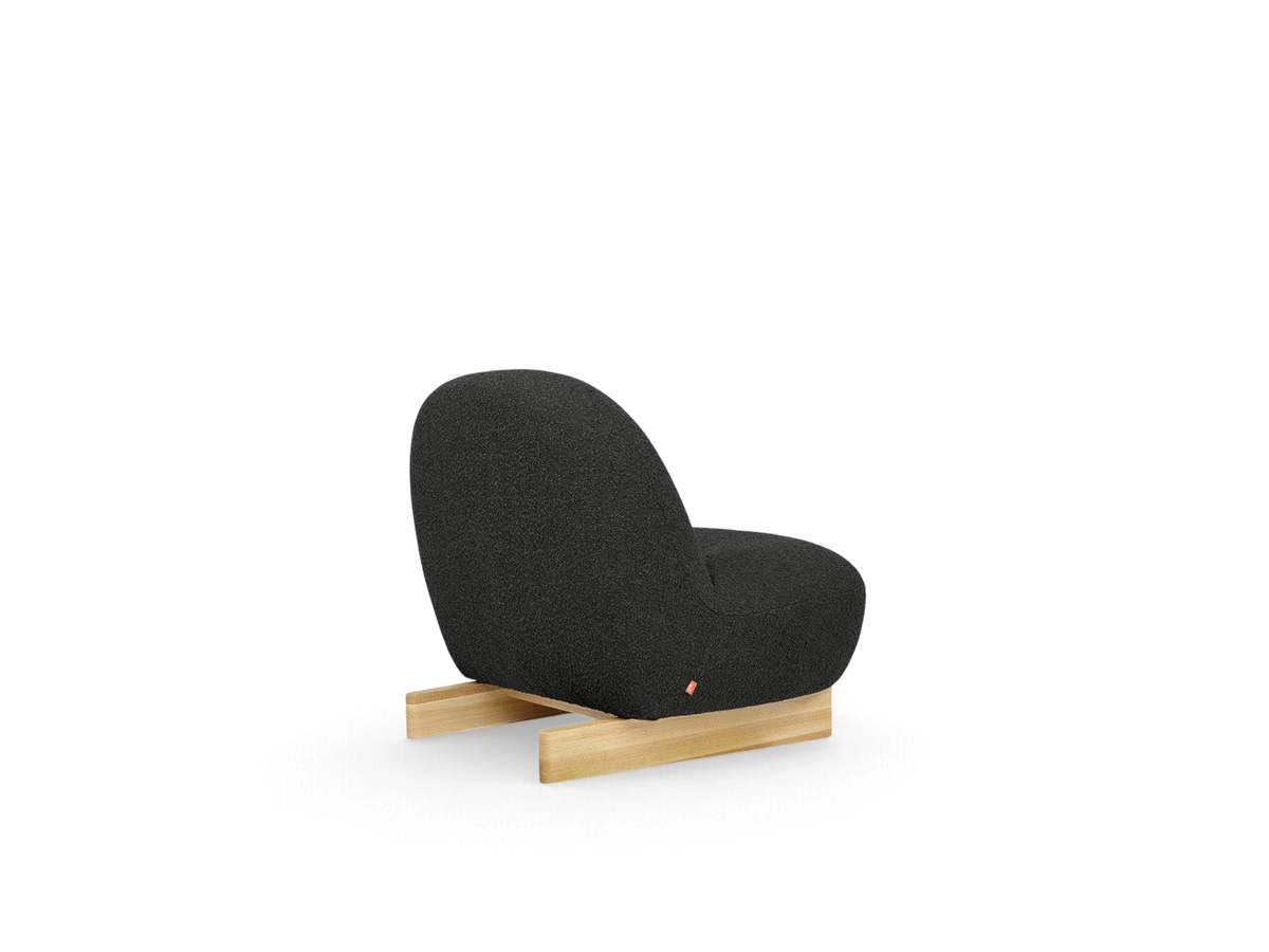 urbane EQ3 Arlo chair in dark grey bouclé fabric with a solid oak sled base, back view