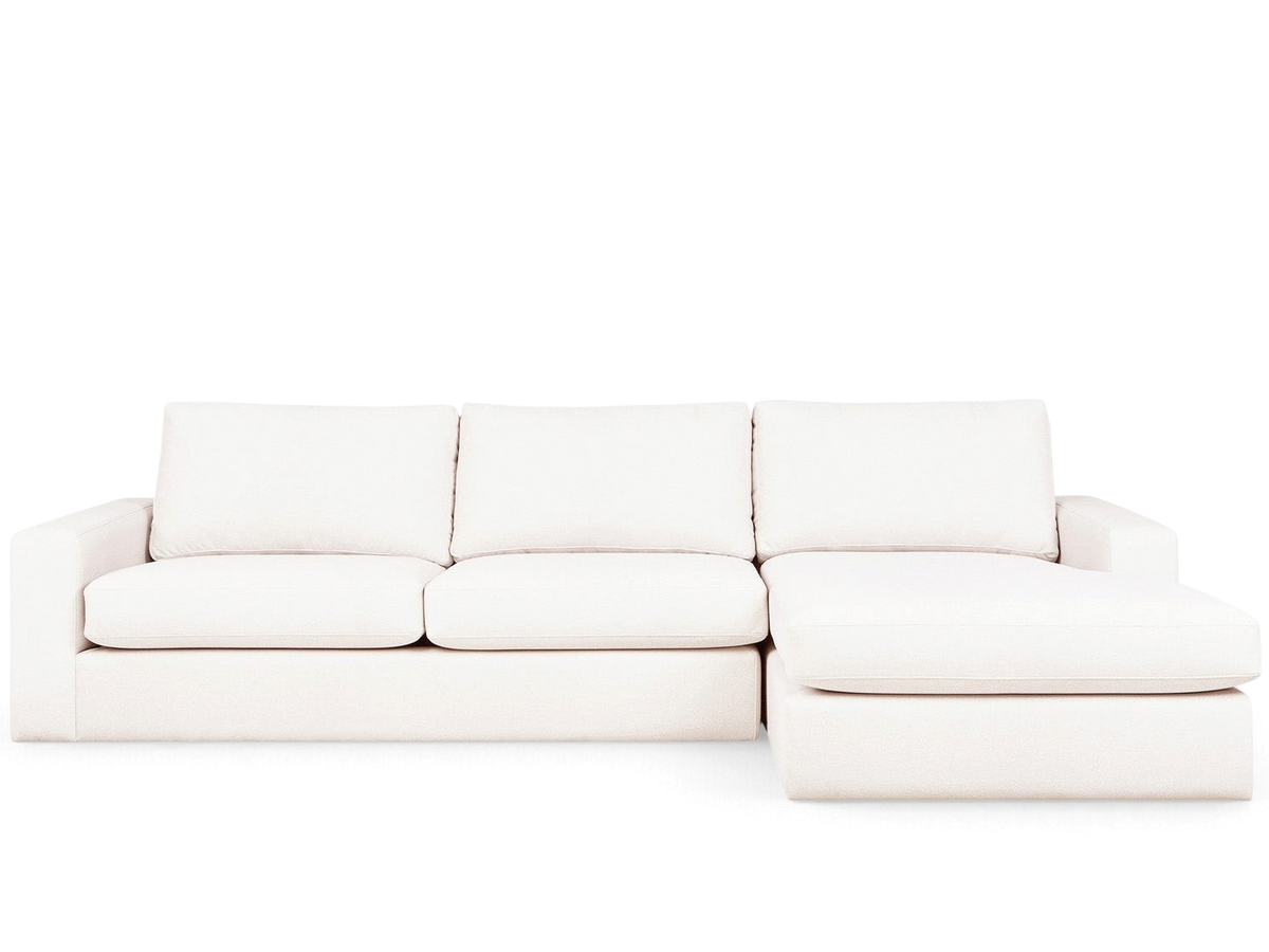 urbane EQ3 Ashdale sectional sofa in a light cream fabric with track arms and a chaise lounge on the right side