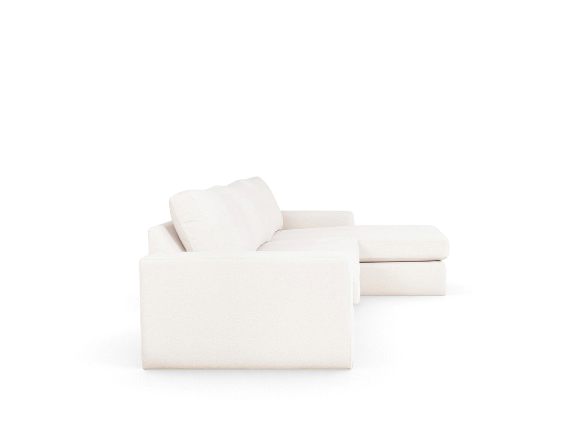 urbane EQ3 Ashdale sectional sofa in light beige fabric with track arms and a chaise lounge, side profile view.