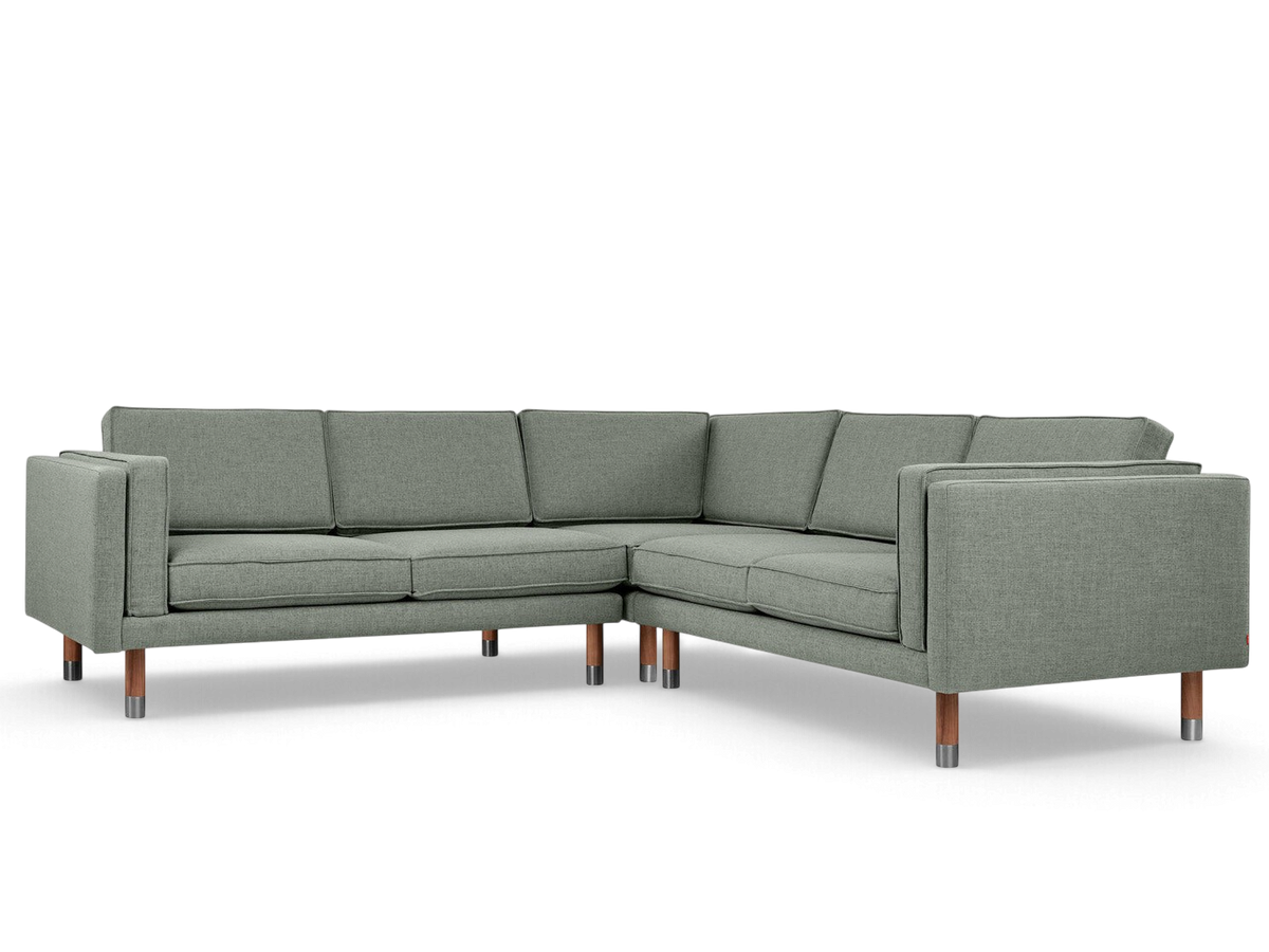 urbane EQ3 Augusta Bi-Sectional corner sofa in grey fabric with solid wood legs and metal accents