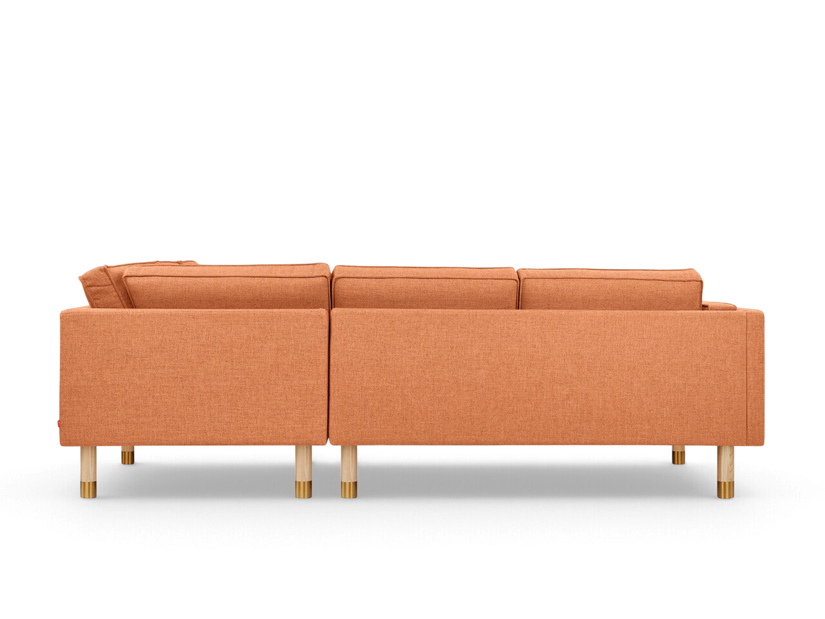 urbane EQ3 Augusta Bi-Sectional in orange linen with natural ash wood legs and brass accents, back view