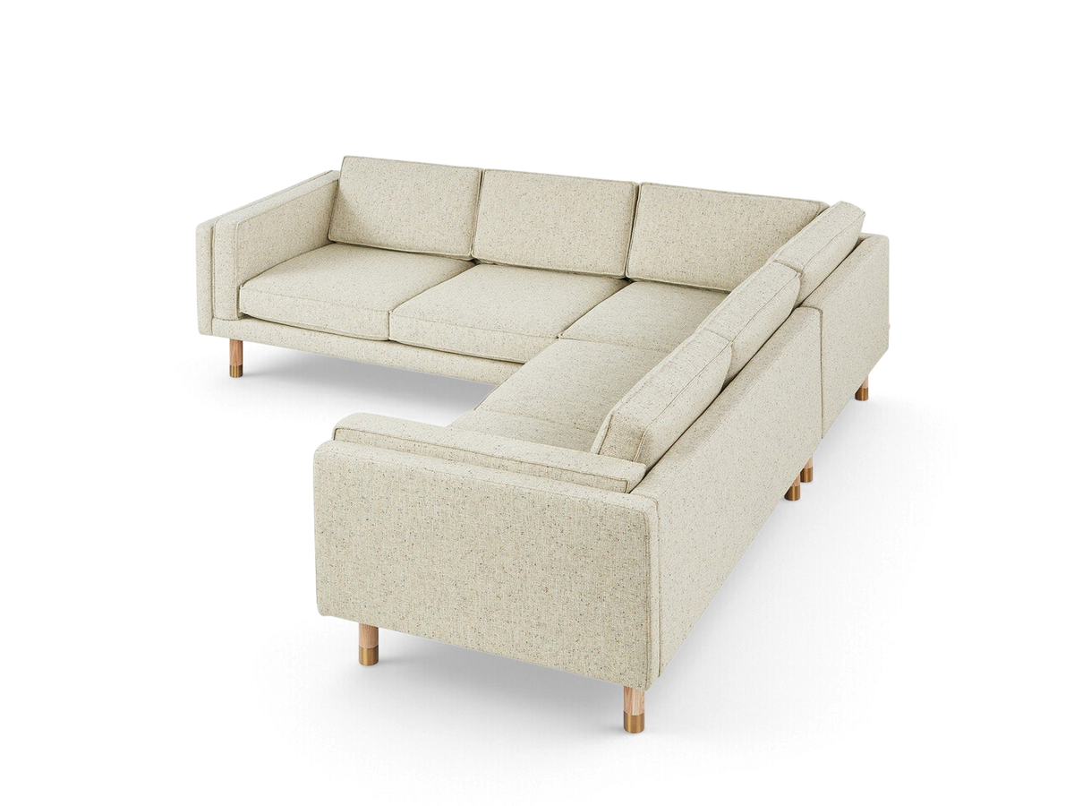 urbane EQ3 Augusta Bi-Sectional corner sofa in light beige linen fabric with solid wood and brass legs