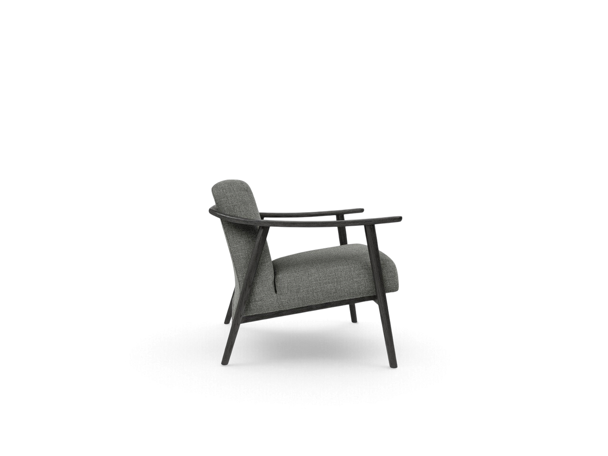 urbane EQ3 Baltic Chair in grey fabric with a dark solid wood frame, featuring curved armrests and minimalist design