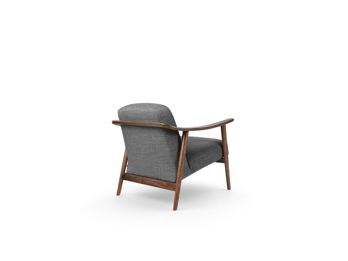 urbane EQ3 Baltic Chair in grey fabric with a dark walnut wood frame, shown from a rear three-quarter angle.