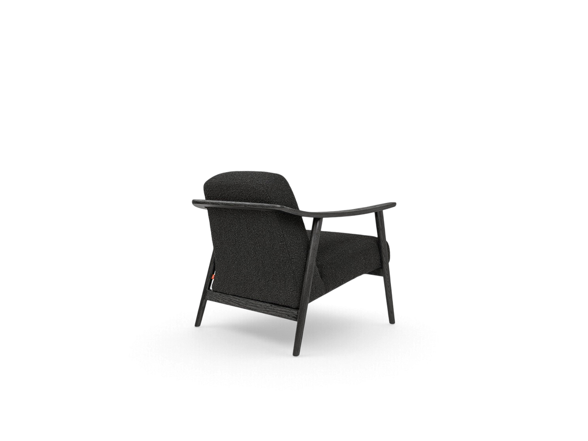 urbane EQ3 Baltic Chair in dark grey fabric with a solid black wood frame, shown from a rear angle.