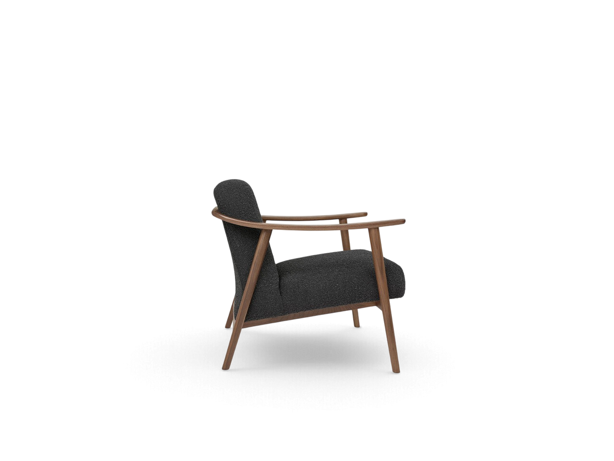 urbane EQ3 Baltic Chair in dark grey fabric with a sculptural walnut wood frame, side view