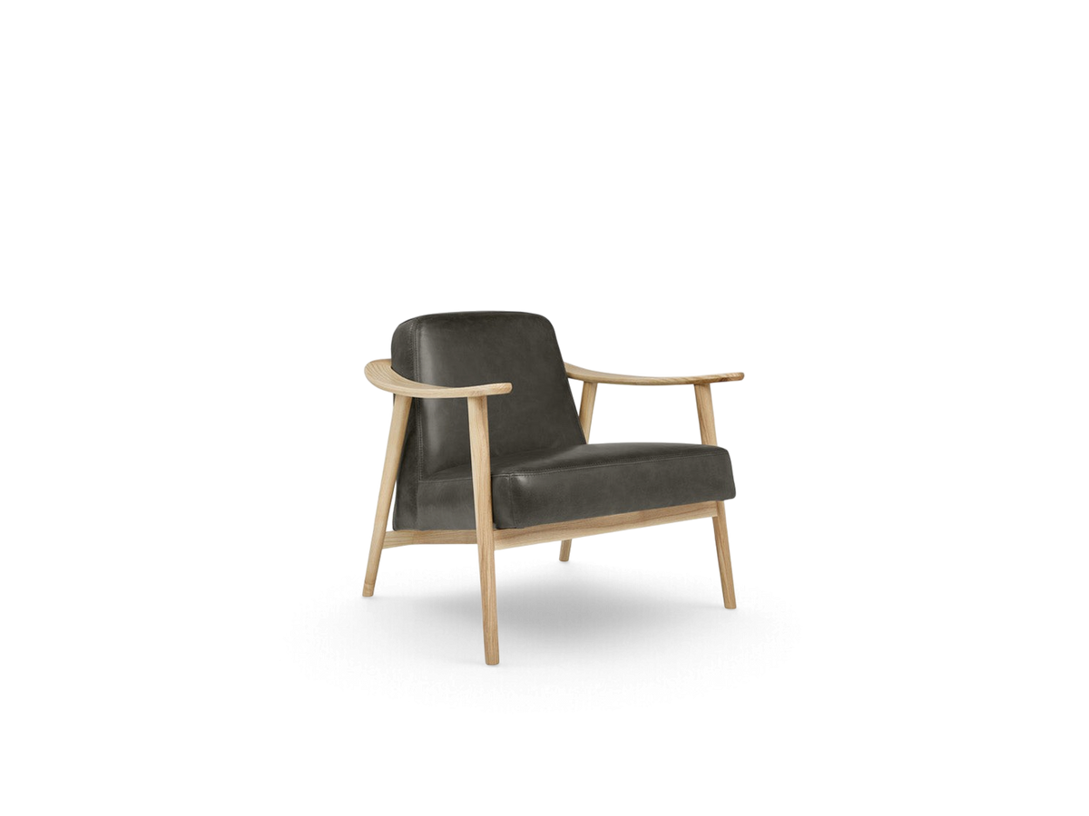 urbane EQ3 Baltic Chair featuring a dark grey upholstered seat and a light solid wood frame with curved armrests.