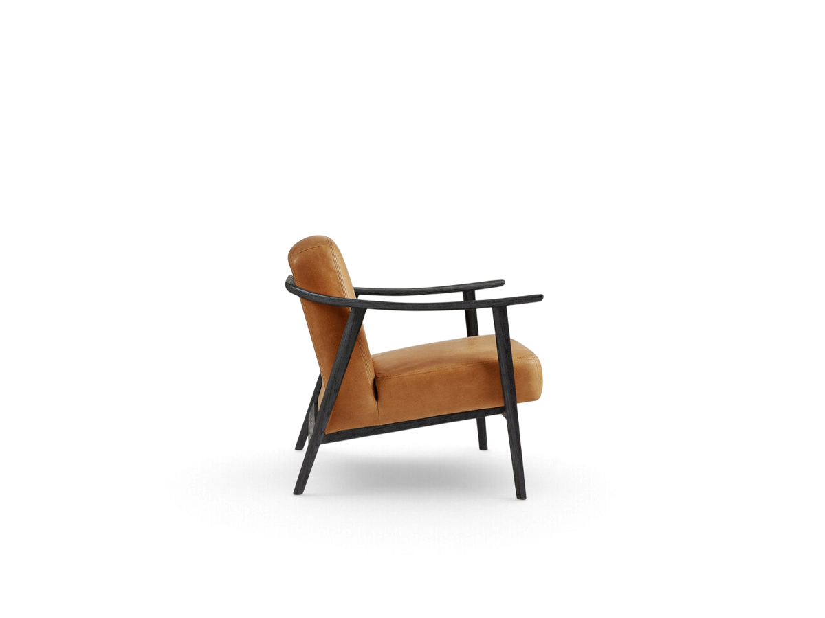 urbane EQ3 Baltic Chair featuring a tan leather seat and a dark solid wood frame in a minimalist Nordic style