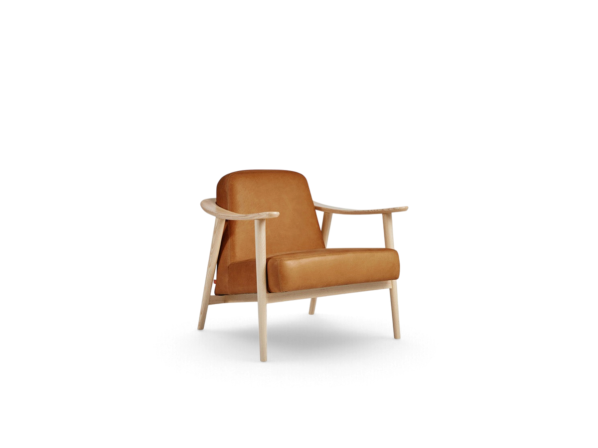 urbane EQ3 Baltic Chair featuring a light ash wood frame and cognac leather upholstery with curved armrests