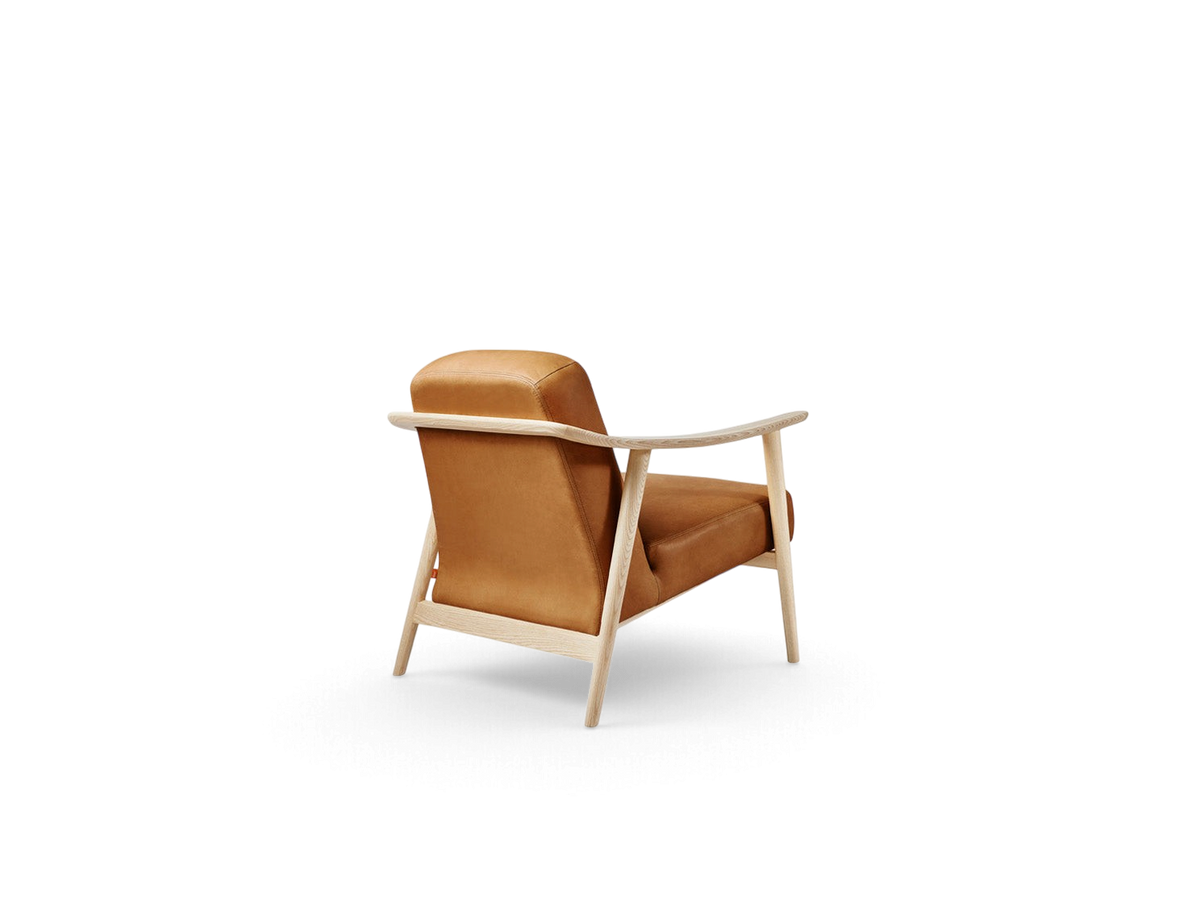 urbane EQ3 Baltic Chair featuring a light ash wood frame and warm tan upholstered seat in a Nordic minimalist style