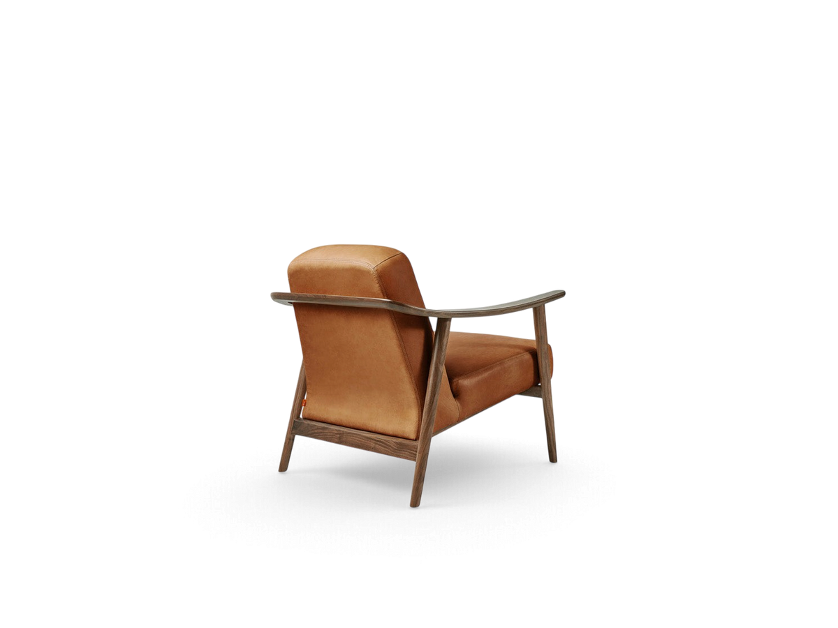 urbane EQ3 Baltic Chair with a warm brown upholstered seat and a sculptural solid walnut wood frame, rear view