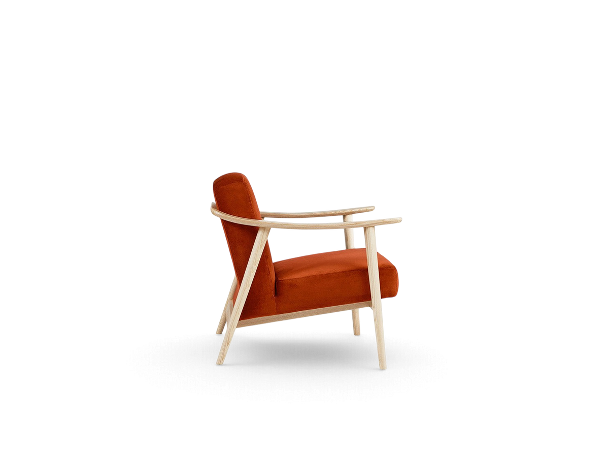 urbane EQ3 Baltic Chair in rust orange fabric with a light ash wood frame, shown from a side profile view.