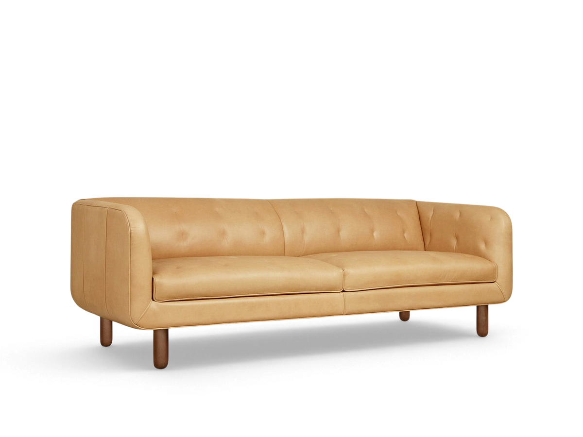 urbane EQ3 Beaconsfield sofa in tan top grain leather with blind-tufted detailing and walnut stained ash wood legs