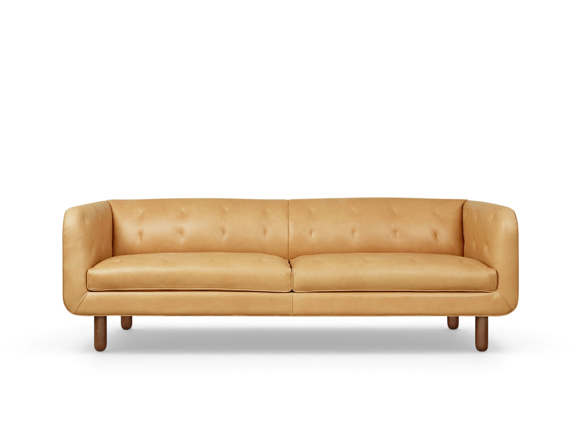 urbane EQ3 Beaconsfield sofa in tan top grain leather with blind-tufted detailing and walnut stained ash wood legs