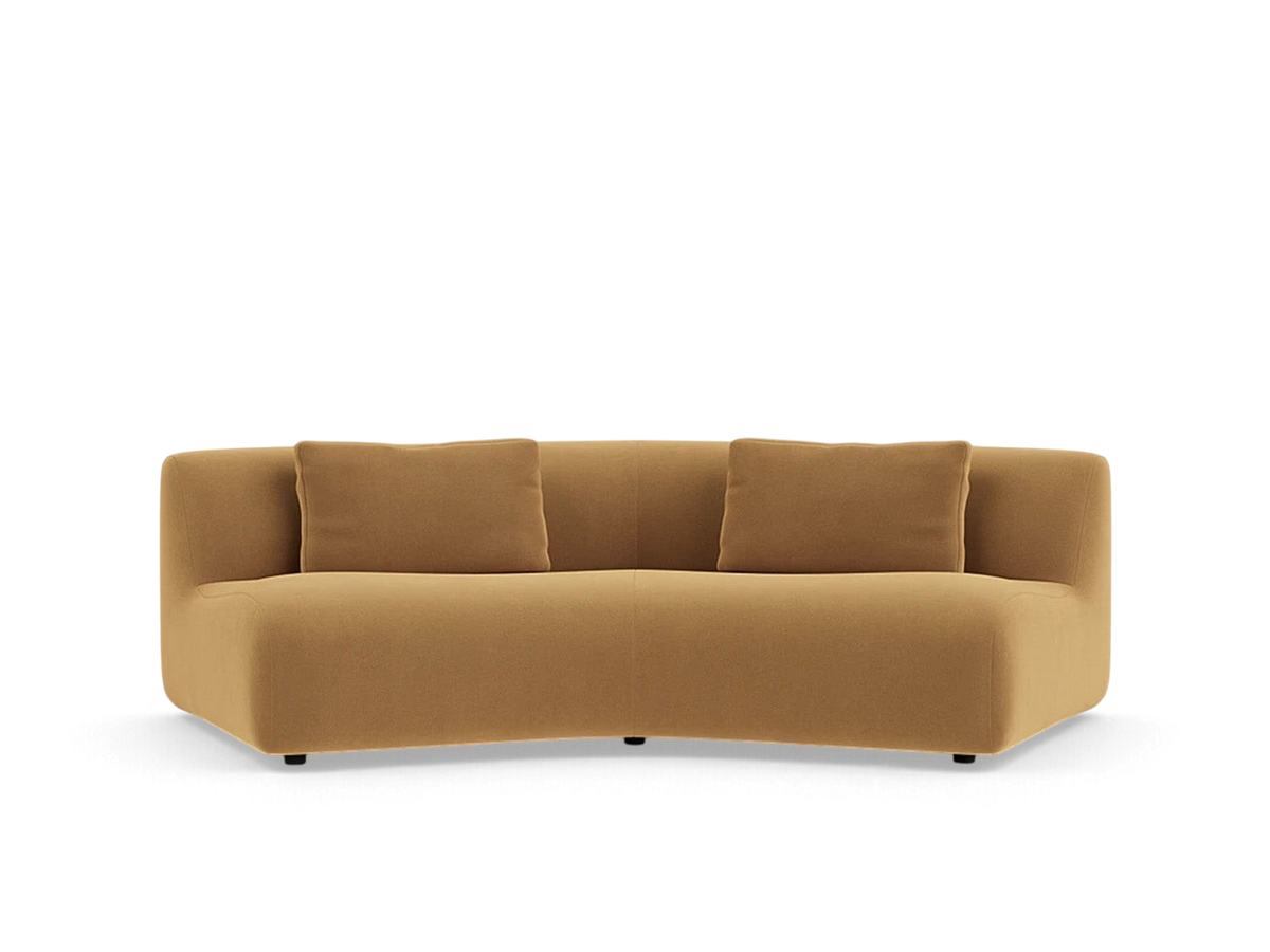urbane EQ3 Bird Angled Corner sofa in a warm tan fabric with a curved, modular design and two matching cushions.