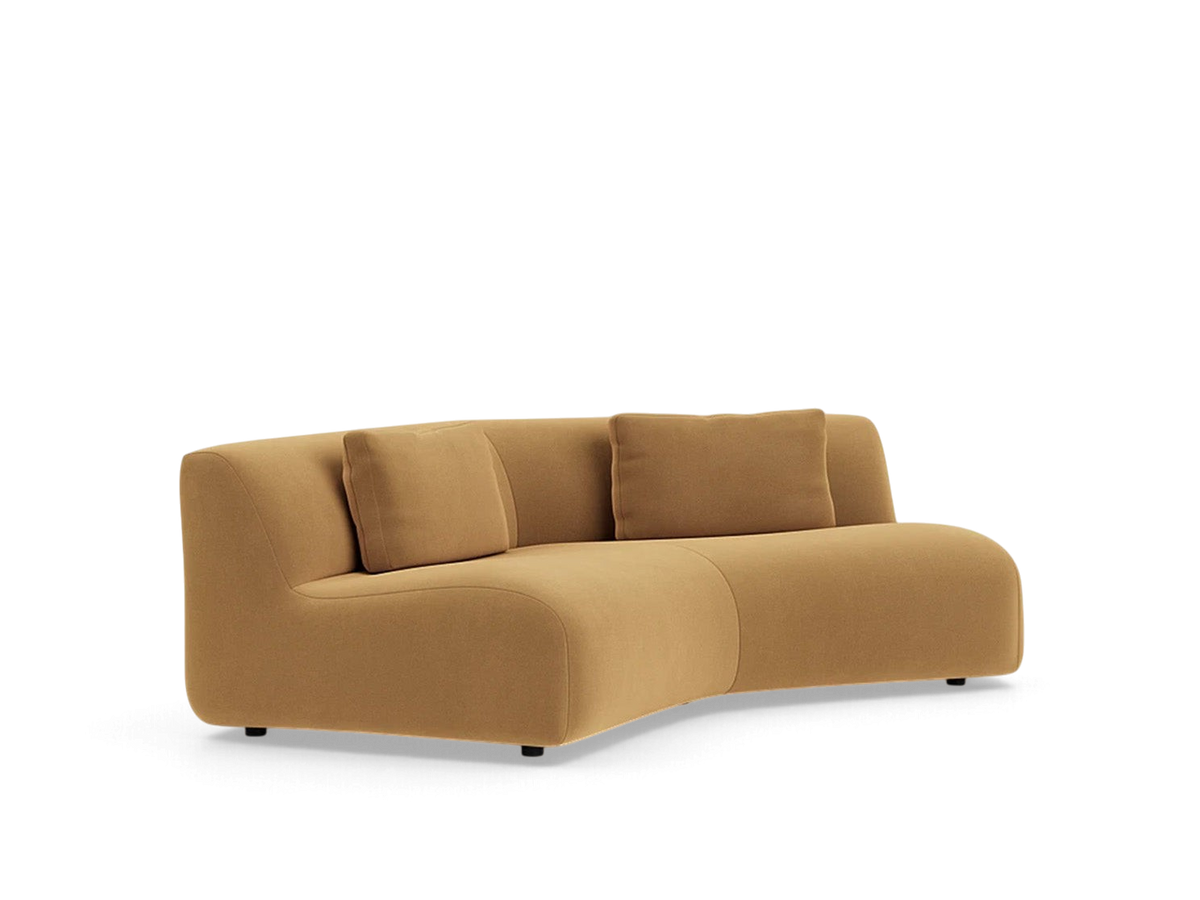 urbane EQ3 Bird Angled Corner sofa in a warm tan fabric with a curved, modular design and two matching cushions.