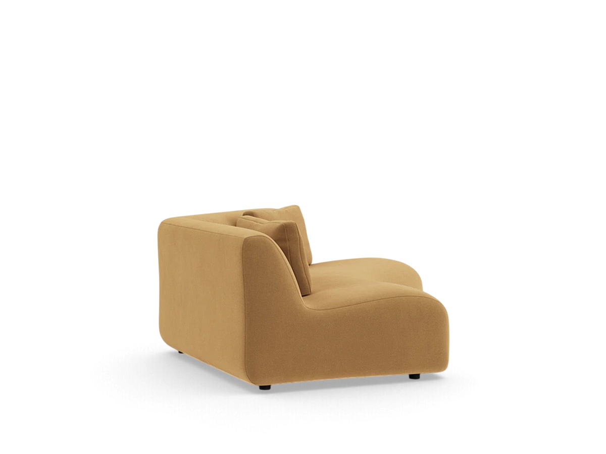 urbane EQ3 Bird angled corner sofa in a warm tan fabric with a modular, low-profile design and relaxed rounded edges.