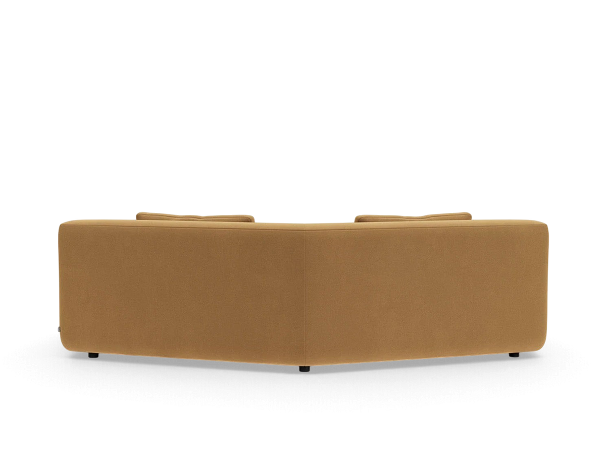 urbane EQ3 Bird angled corner sofa in a warm tan fabric with a modular, low-profile design and rounded edges.