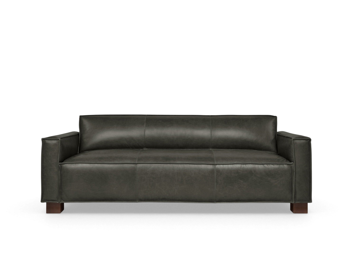 urbane EQ3 Cabot Sofa in dark vintage leather with French seam detailing and walnut stained block feet