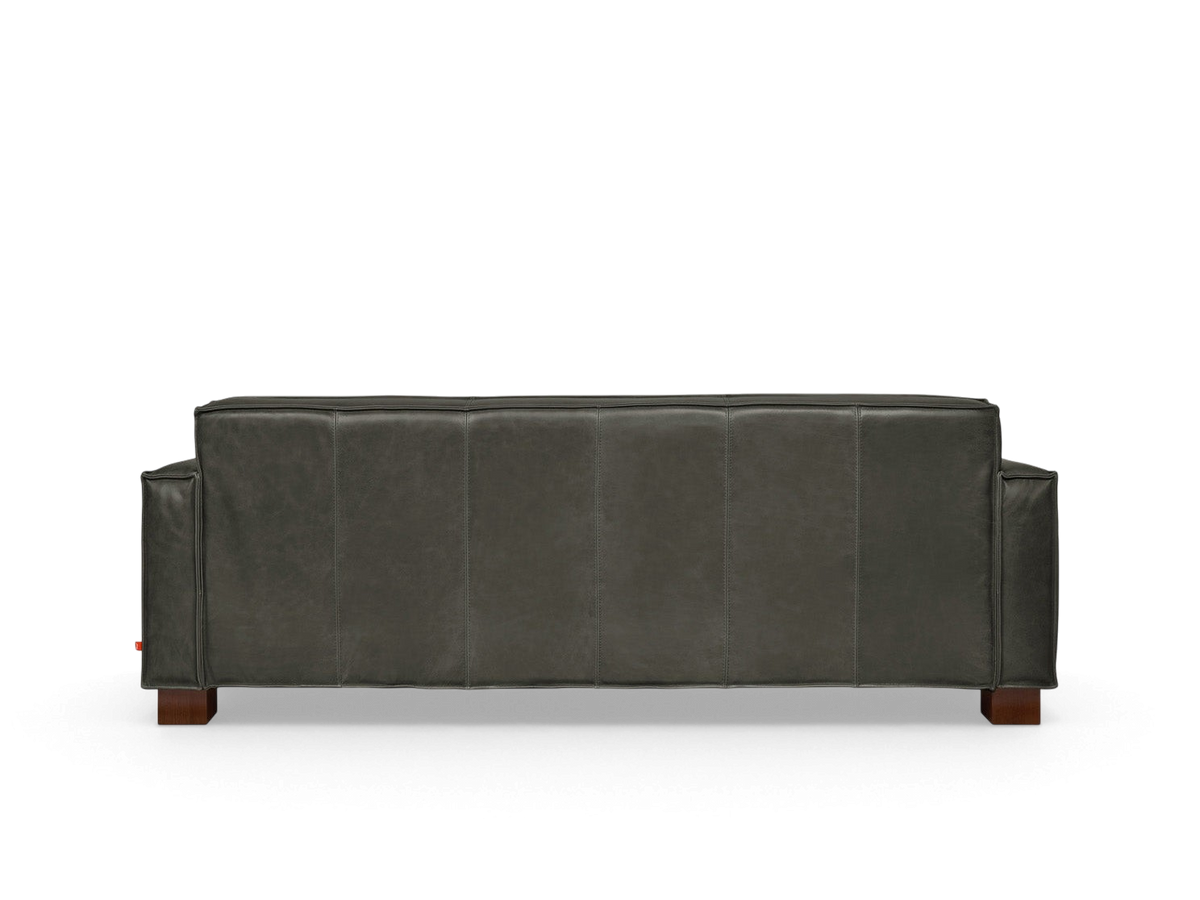 urbane EQ3 Cabot Sofa in dark top grain aniline-dyed leather with French seam detailing and walnut stained block feet