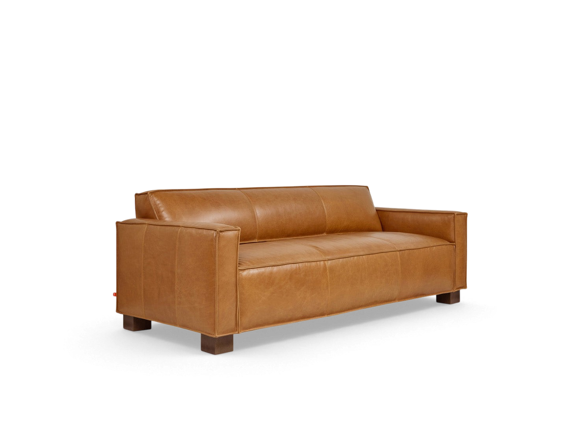 urbane EQ3 Cabot Sofa in tan top grain aniline-dyed leather with French seam detailing and walnut stained block feet