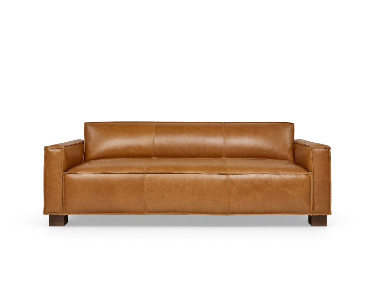 urbane EQ3 Cabot Sofa in tan top grain aniline-dyed leather with French seam detailing and walnut-stained block feet.