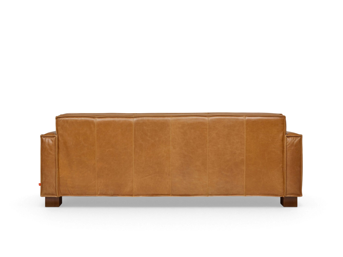 urbane EQ3 Cabot Sofa in tan top grain aniline-dyed leather with French seam detailing and walnut stained block feet