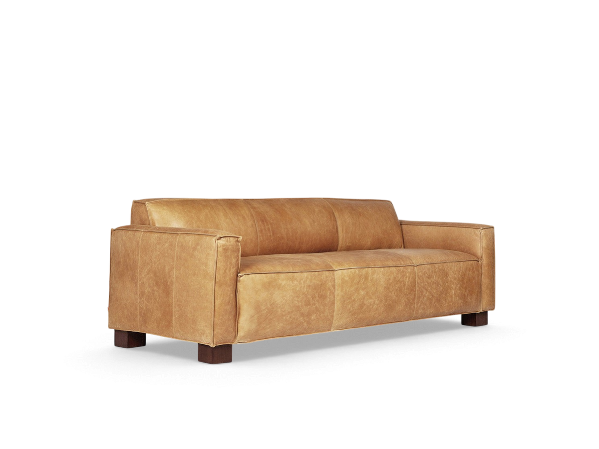 urbane EQ3 Cabot sofa in tan top grain aniline-dyed leather with French seam detailing and walnut stained block feet