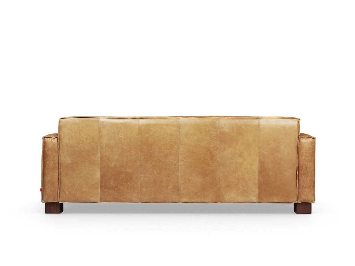 urbane EQ3 Cabot Sofa in tan top grain aniline-dyed leather with French seam detailing and walnut stained block feet