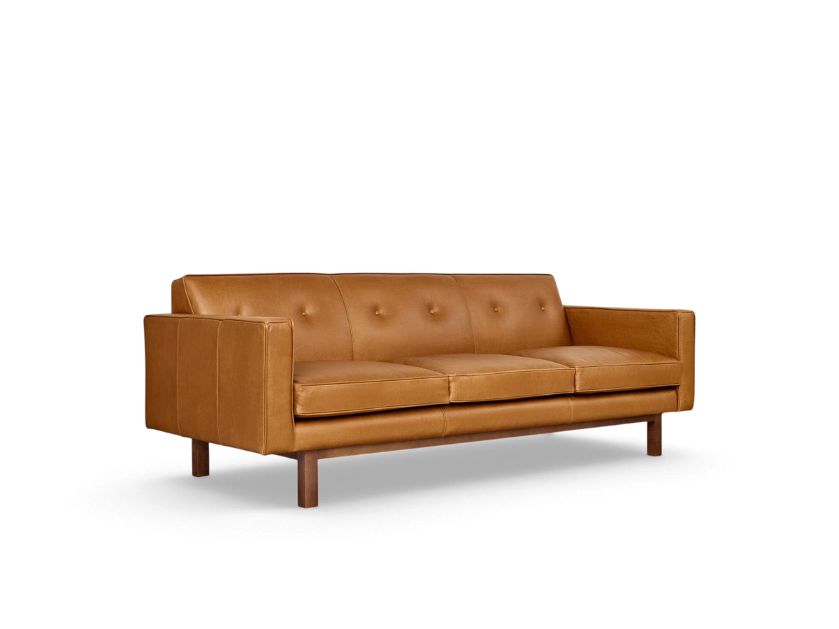 urbane EQ3 Embassy Sofa in tan top grain leather with button-tufted back and walnut stained wooden base