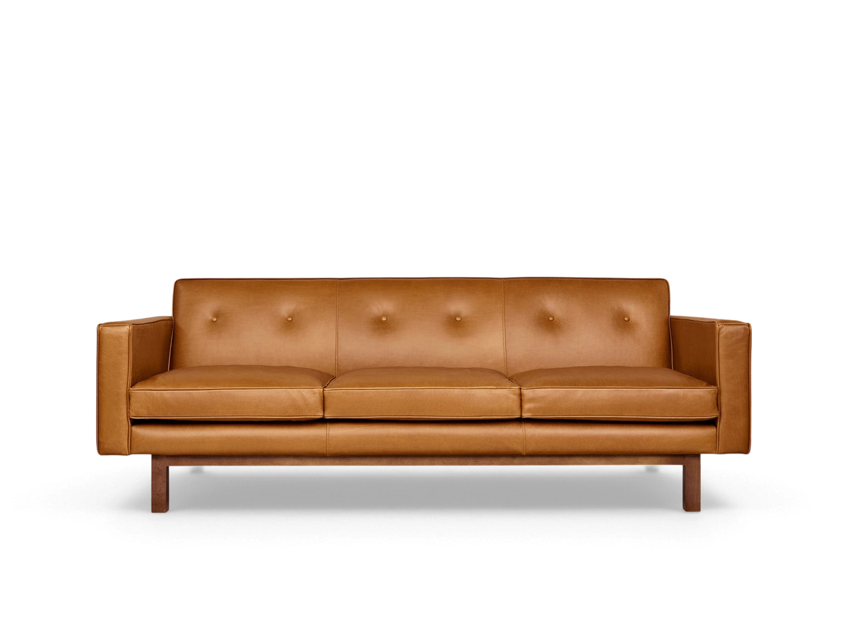 urbane EQ3 Embassy Sofa in tan top grain leather with button-tufted back and walnut stained wood base