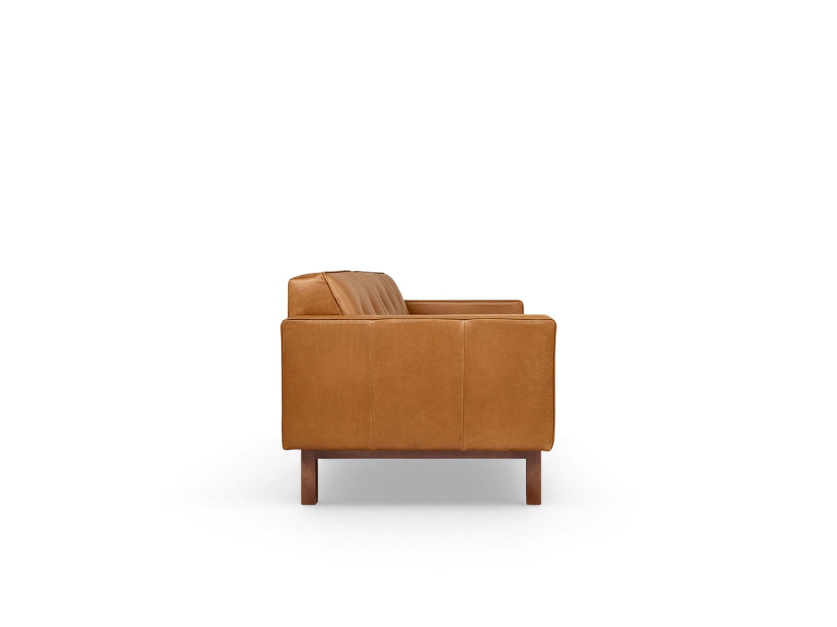 urbane EQ3 Embassy Sofa in tan leather with button-tufted back and walnut-stained wood base, side profile view