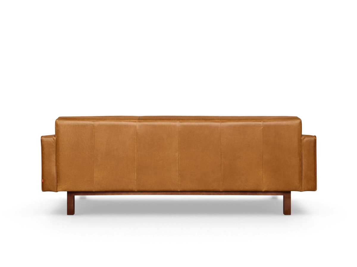 urbane EQ3 Embassy Sofa in tan top grain leather with a mid-century modern design and walnut stained wood base
