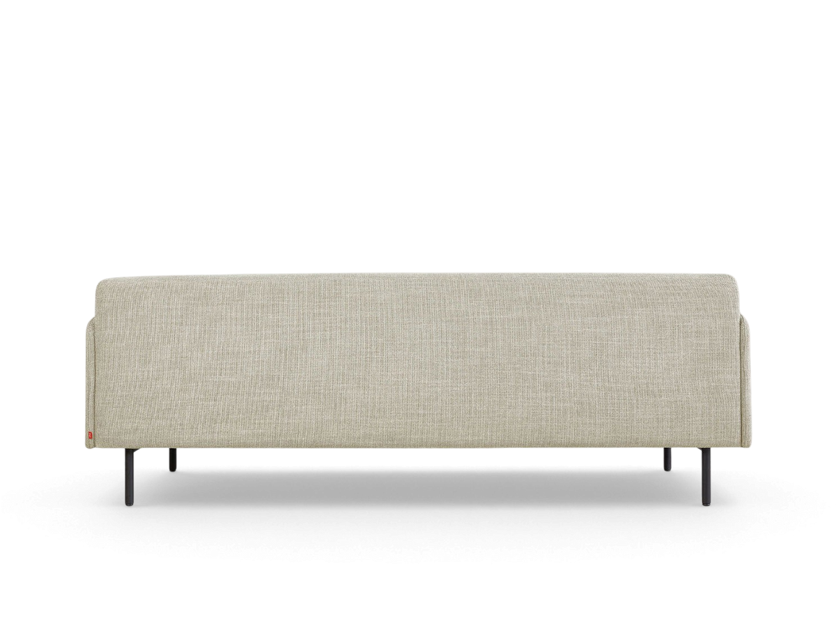 urbane EQ3 Foundry Sofa in light beige fabric with a minimalist tightback design and black cylindrical steel legs