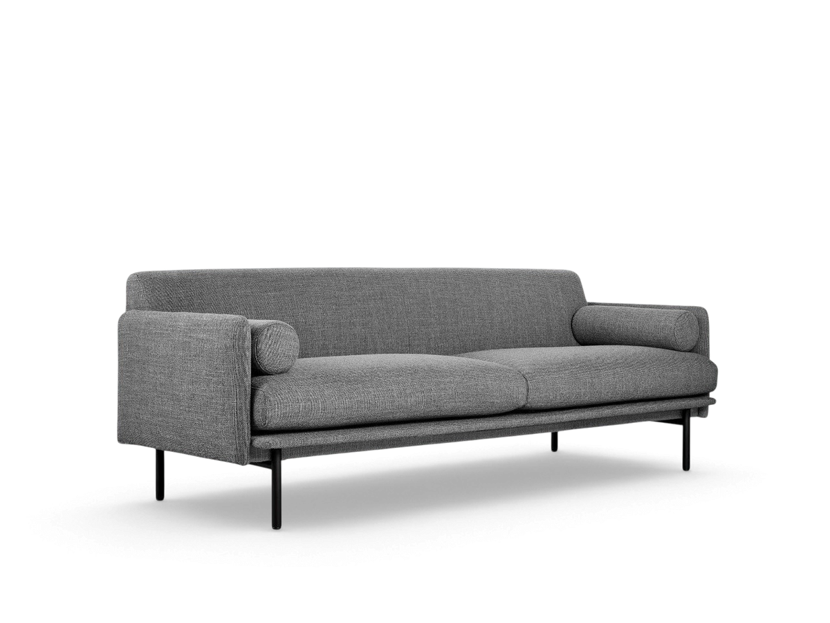 urbane EQ3 Foundry Sofa in grey fabric with black steel legs and two matching bolster cushions in a minimalist style
