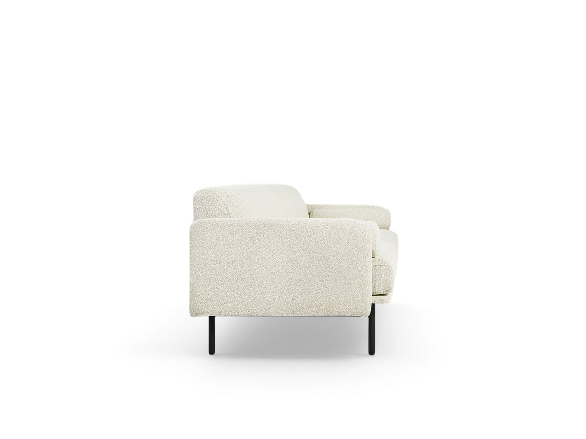 urbane EQ3 Foundry Sofa in cream textured fabric with a minimalist tightback design and black steel legs, side view.