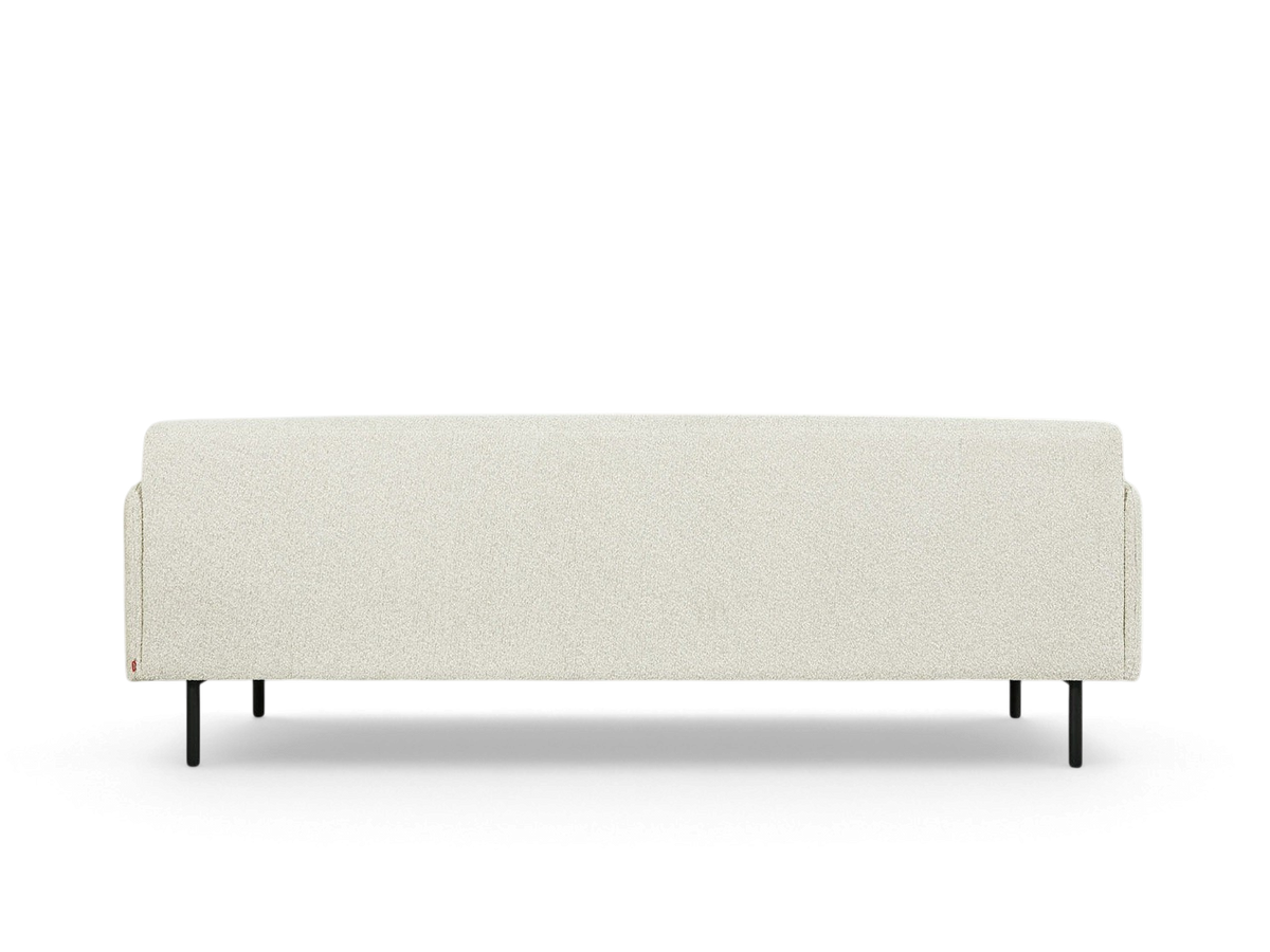 urbane EQ3 Foundry Sofa in light cream fabric with a minimalist tightback design and black cylindrical steel legs