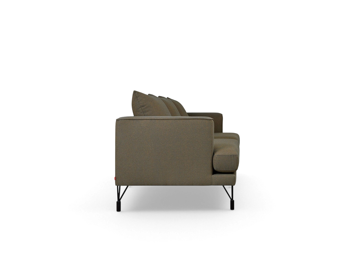 urbane EQ3 Highline sofa in a neutral textured fabric with slim black metal legs, shown from a side profile view.
