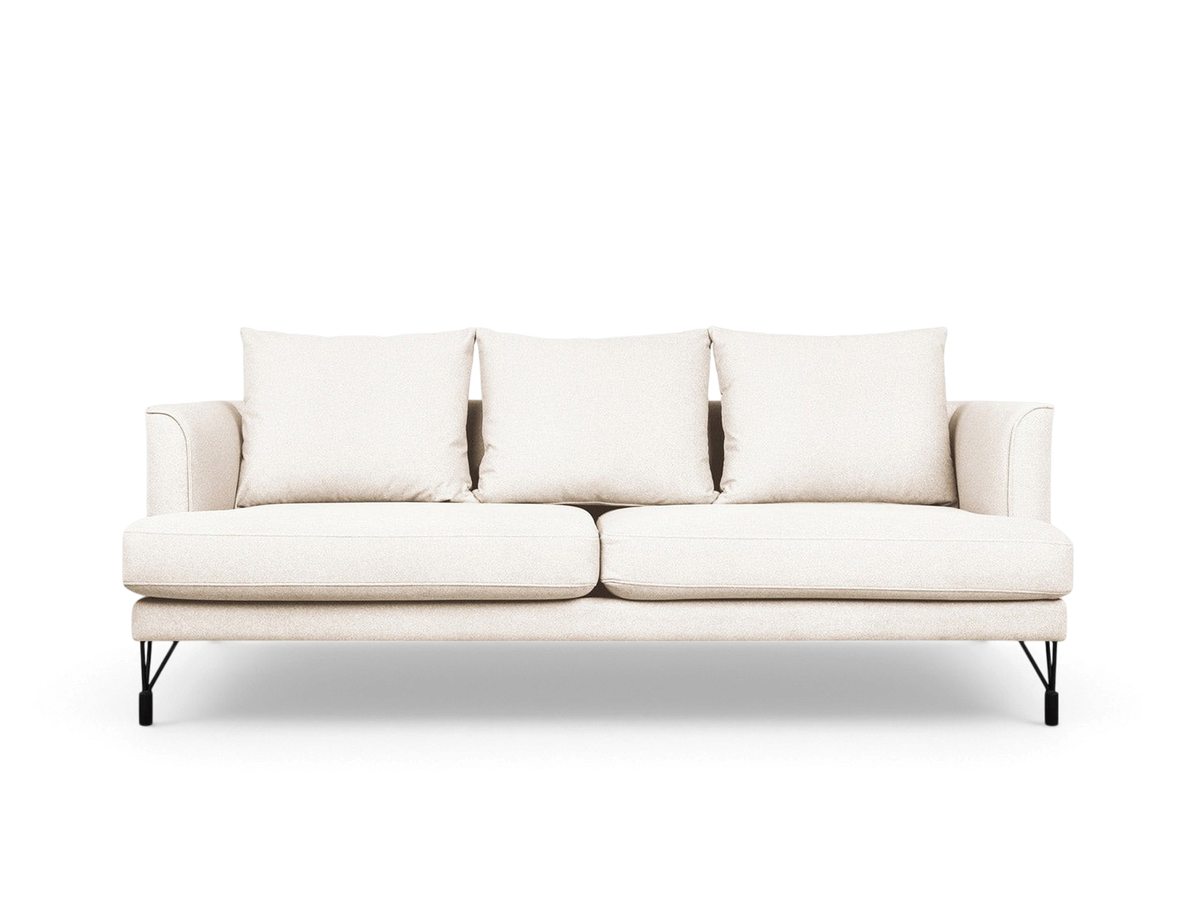 urbane EQ3 Highline sofa in light beige fabric with curved arms, French-seam detailing, and slim black metal legs.