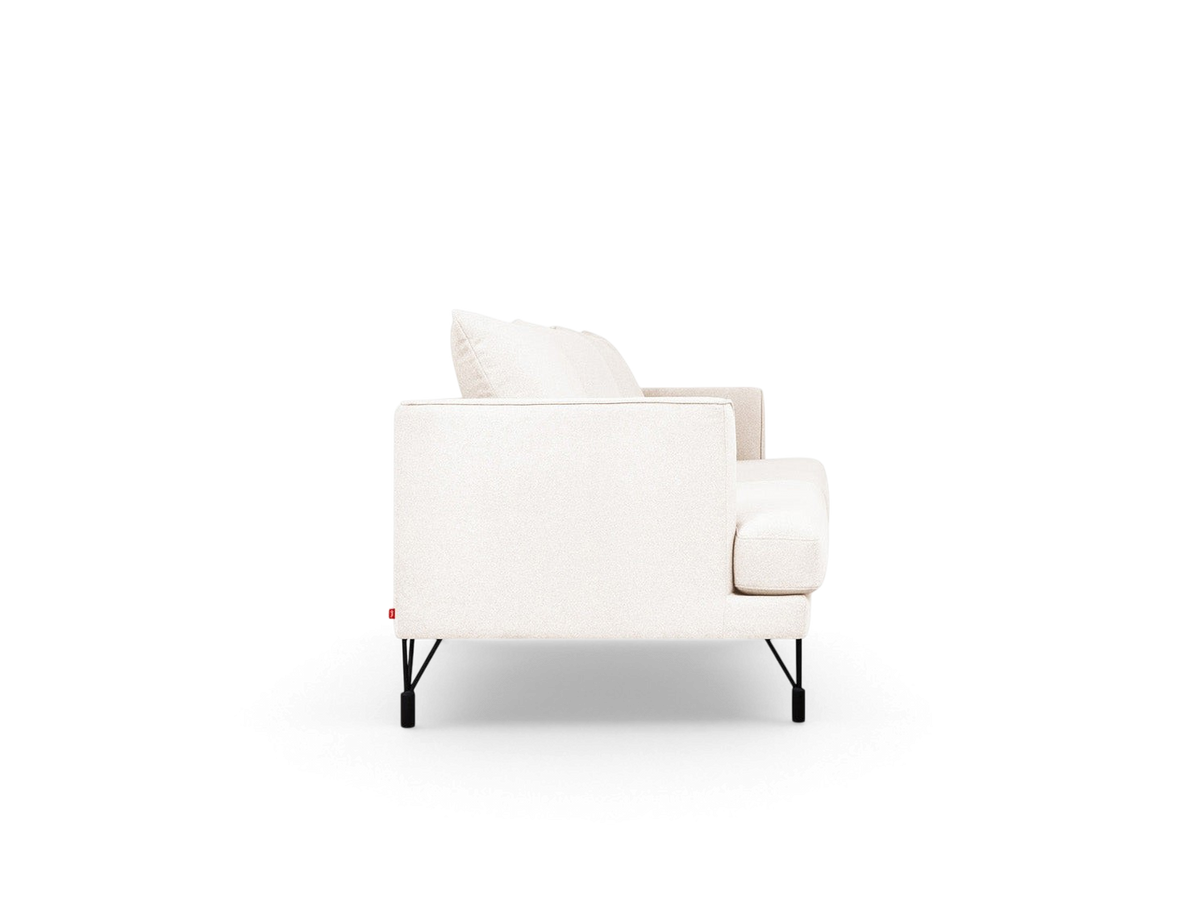 urbane EQ3 Highline Sofa in light fabric with slim frame, curved arms, and black architectural metal legs, side view