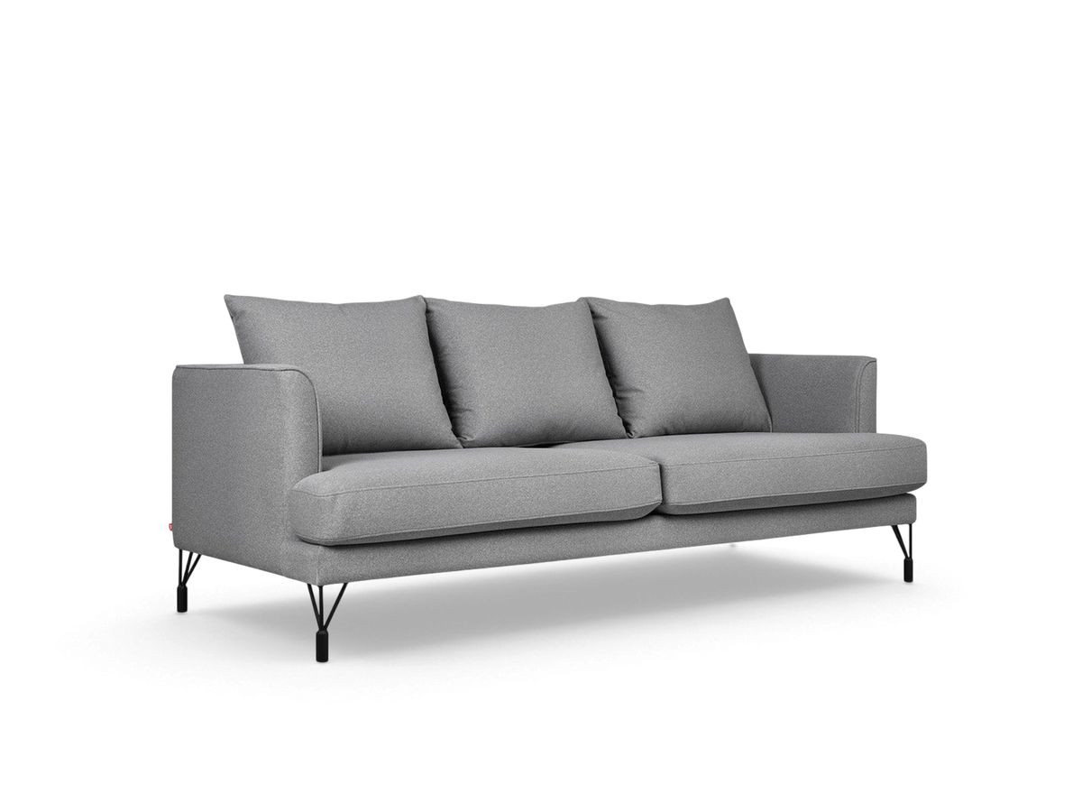 urbane EQ3 Highline Sofa in grey fabric with curved arms, French-seam detailing, and slender black architectural legs.