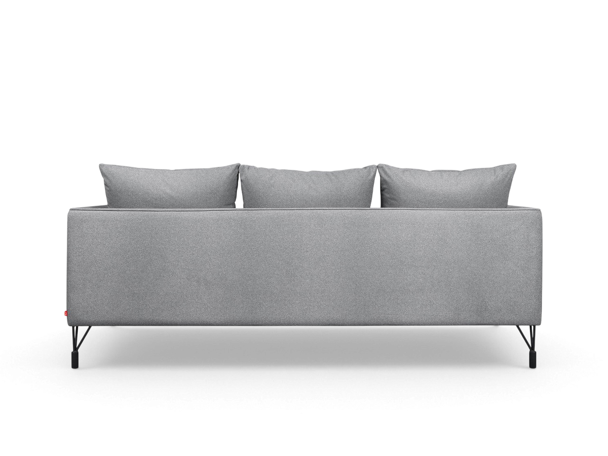 urbane EQ3 Highline Sofa in grey fabric with slim architectural legs and French-seam detailing, back view