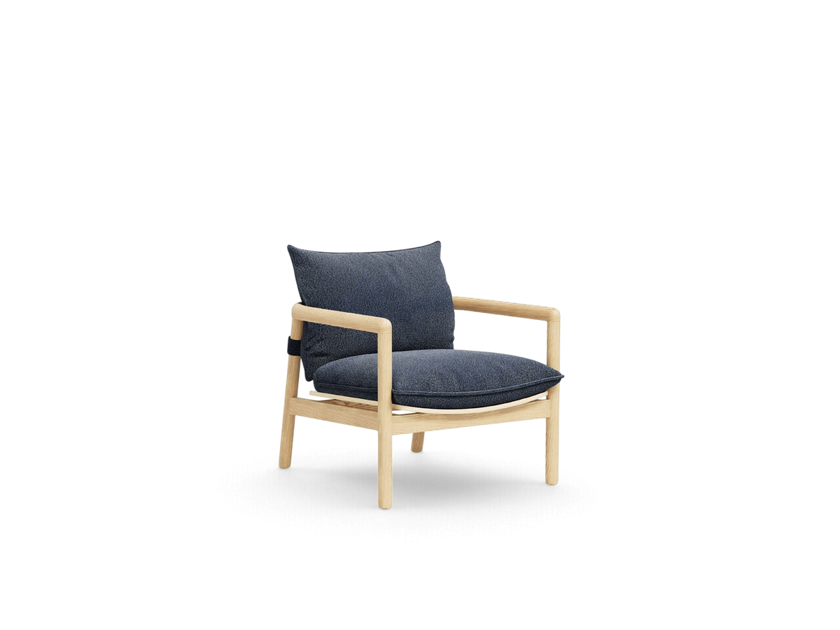 urbane EQ3 Humber Chair with a light ash wood frame and dark blue upholstered cushions in a minimalist design