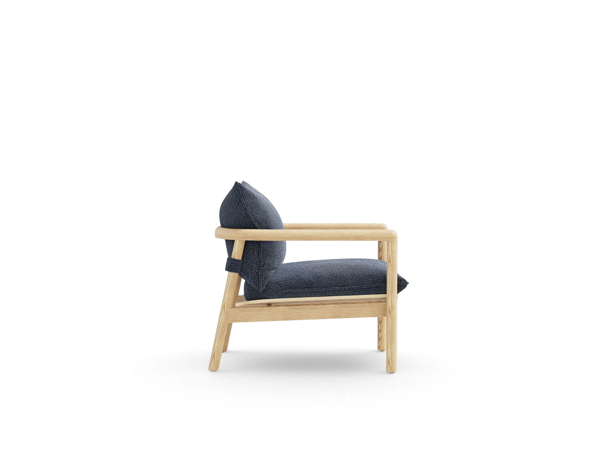 urbane EQ3 Humber Chair with a solid ash wood frame and dark blue upholstered cushions in a side profile view