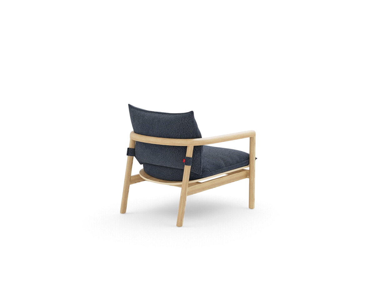 urbane EQ3 Humber Chair with a light ash wood frame and dark grey textured fabric cushions, rear view.