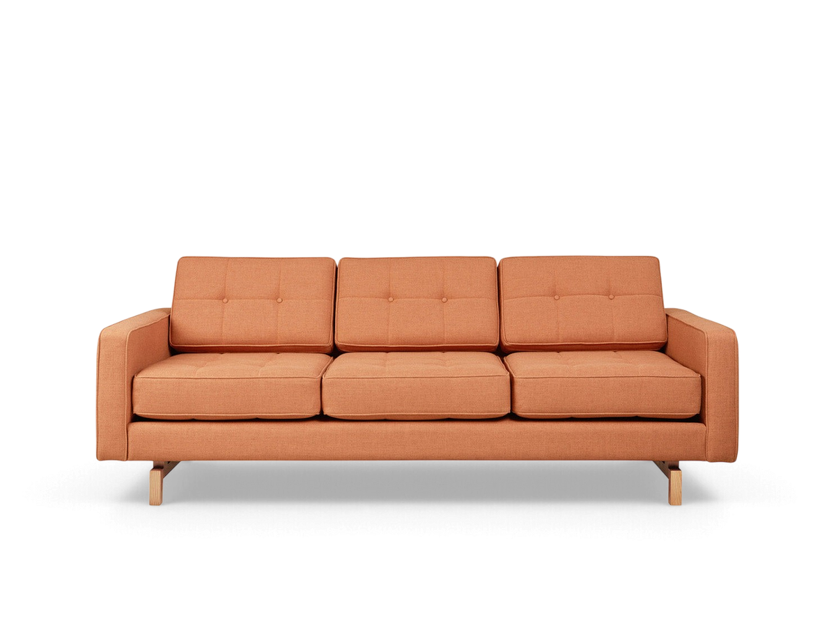urbane EQ3 Jane 2 sofa in burnt orange fabric with button-tufted cushions and a light wood inset base