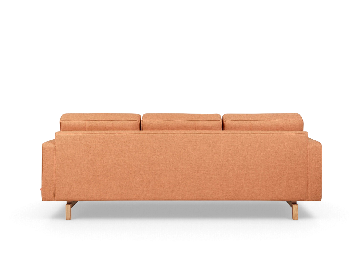 urbane EQ3 Jane 2 sofa in orange fabric with button-tufted cushions and a light wood base, back view